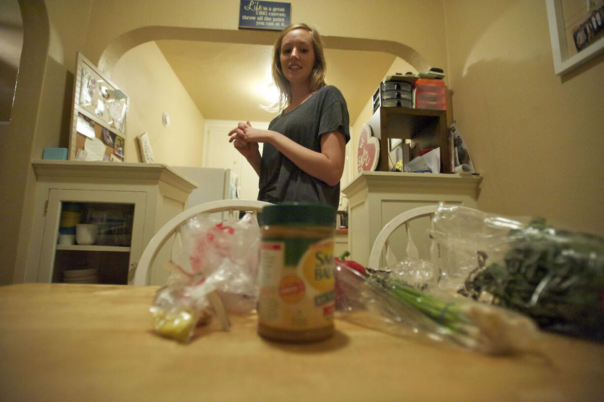 Audrey Williams, 22, gets ready to make African-style soup with the the groceries she could afford on a SNAP (food stamps) budget.