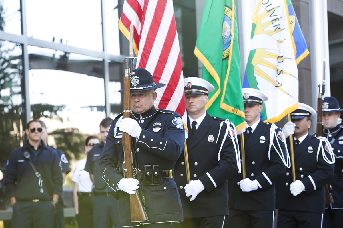 Honor Guards from the Vancouver Police and Fire departmentd pay tribute during the Patriot Day ceremony at Vancouver City Hall on Tuesday, the 11th anniversary of the Sept.