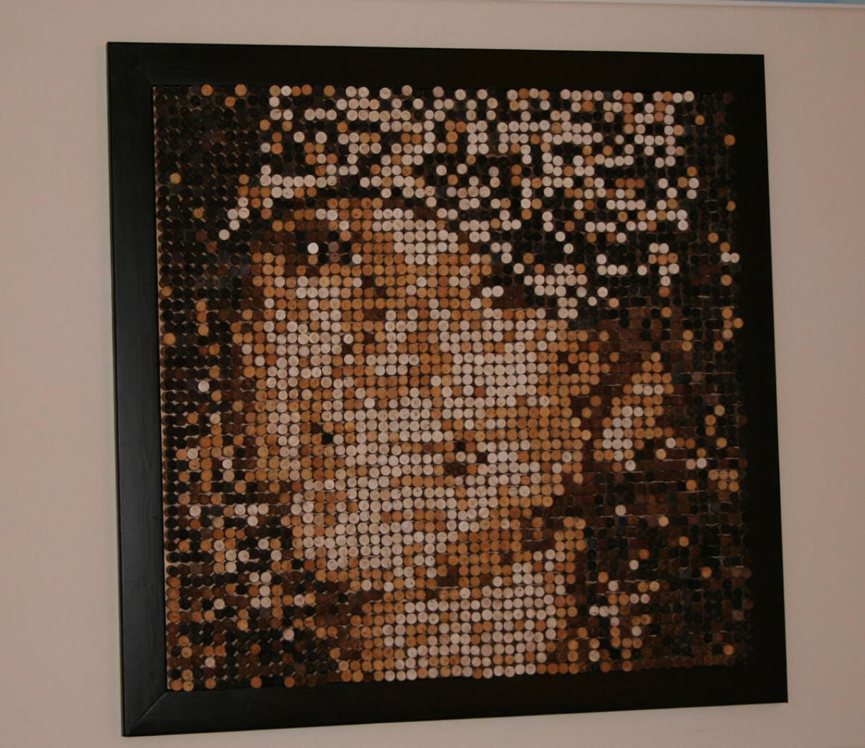 Battle Ground: It took Nathan Rebman about 36 hours to craft a unique portrait of his wife Trisha, an image made entirely of wine corks.