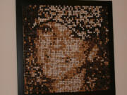 Battle Ground: It took Nathan Rebman about 36 hours to craft a unique portrait of his wife Trisha, an image made entirely of wine corks.