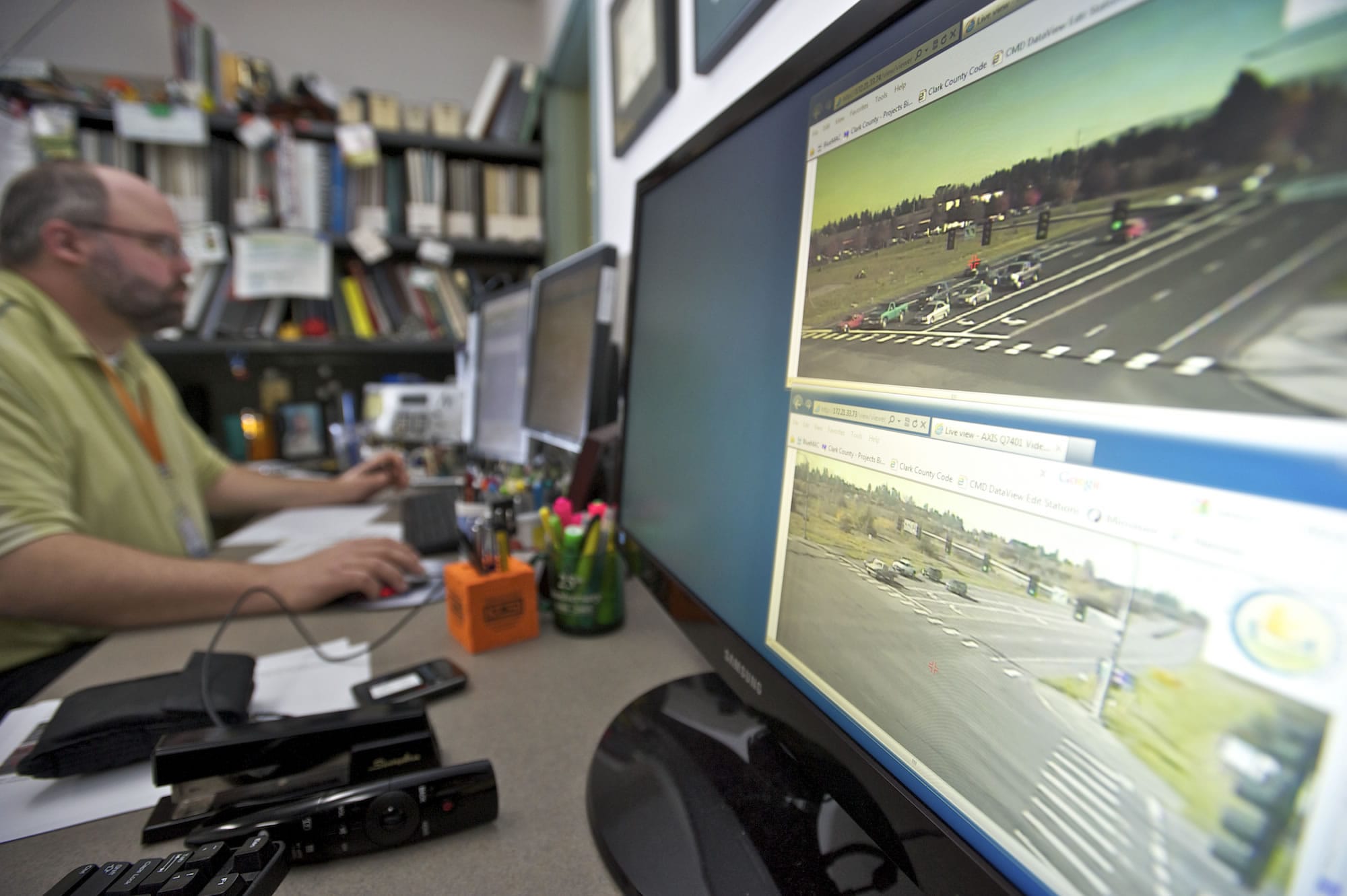 County traffic signal operations and engineering lead Rob Klug watches traffic flow and monitors traffic signal performance inside the Clark County Public Services building on Friday.