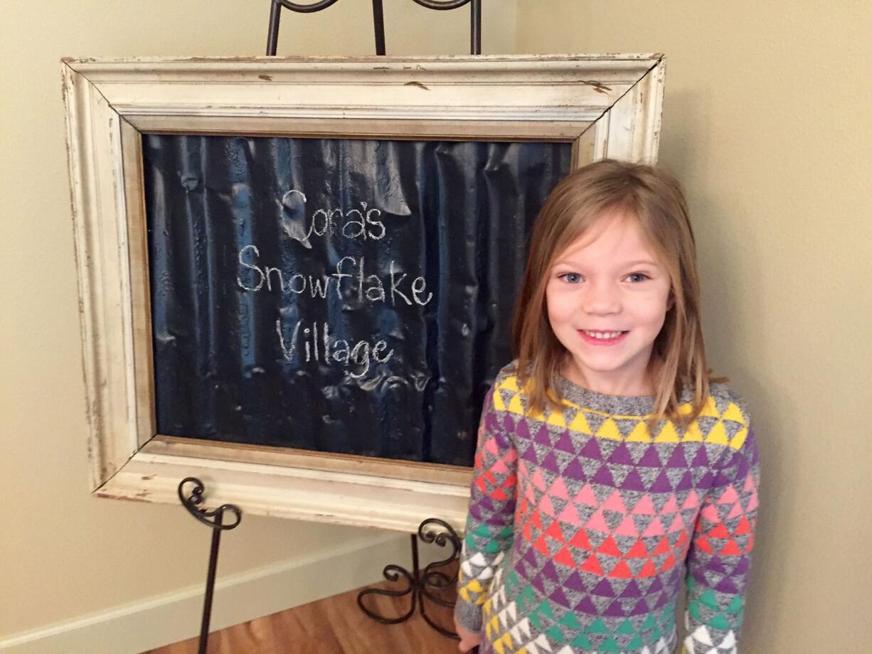 Cora Marbrey, 5, sold more than 140 handmade crafts at her second annual Snowflake Village, bringing in $875, which she will use to buy toys for kids at The Children&#039;s Center.