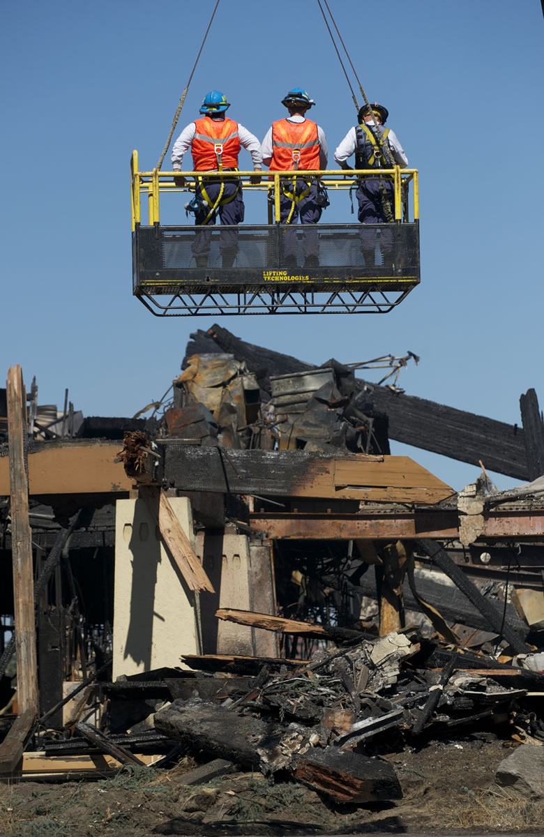 Officials say the investigation into the five-alarm fire at the Thunderbird on the River hotel could take at least a week.