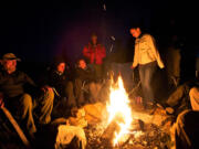 Sitting around a campfire, geologists from several countries swap tales about mysterious creatures at the Mount St.