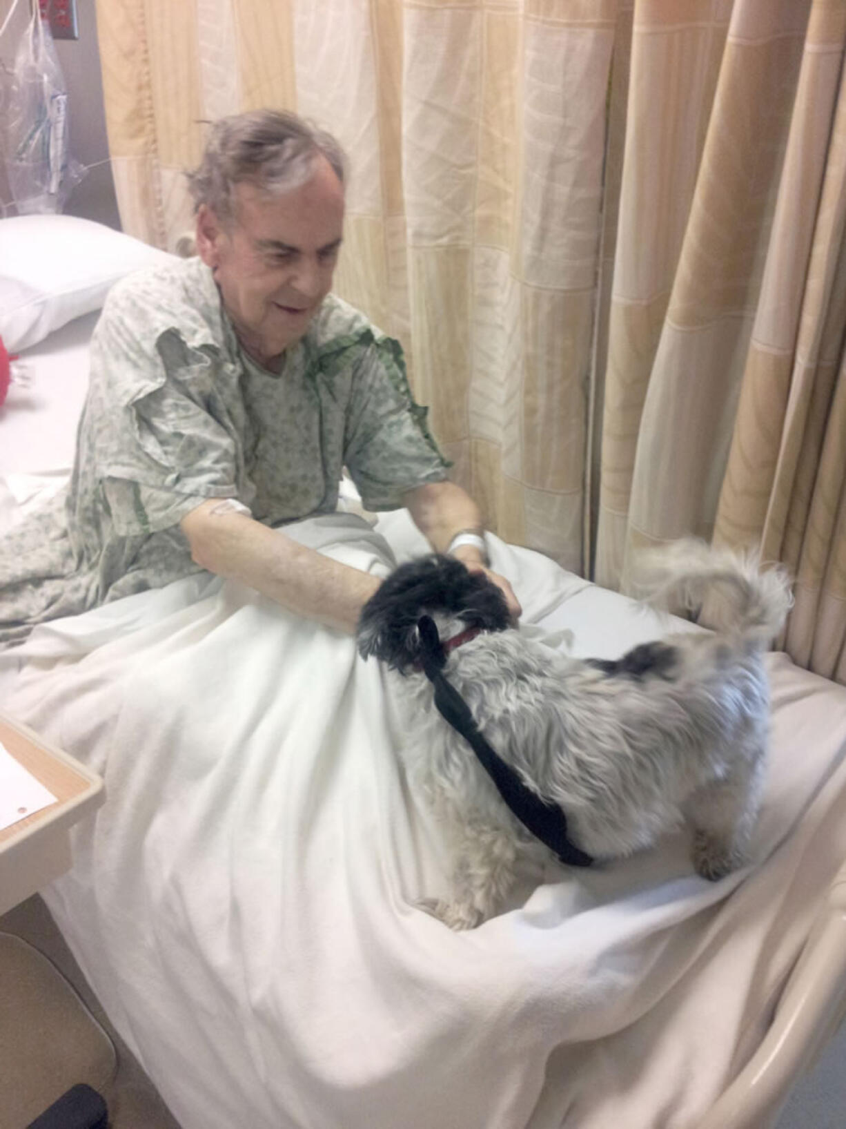 Harry Furlong, 75, of Battle Ground gets a visit from his dog, Maggie.