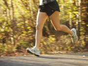 A runner runs along the Salmon Creek Trail in Vancouver on Wednesday.