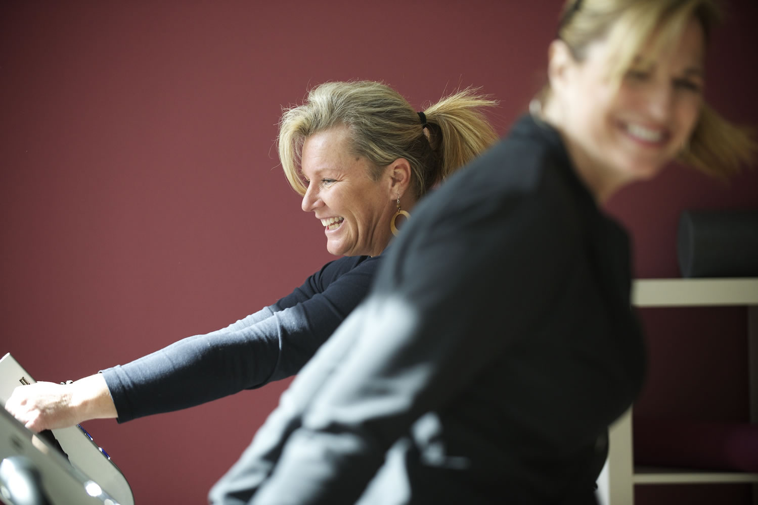 Vancouver residents Tara Sandvig, left, and Kari Muhlhauser work out on whole-body vibration machines at Pro Vitae Vibration Studio in downtown Vancouver Monday.