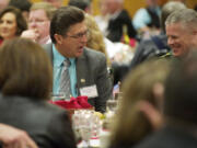 Keynote speaker Richard Mack, left, speaks with Linn County, Ore., Sheriff Tim Mueller at the Lincoln Day Dinner held at the Heathman Lodge on Saturday.