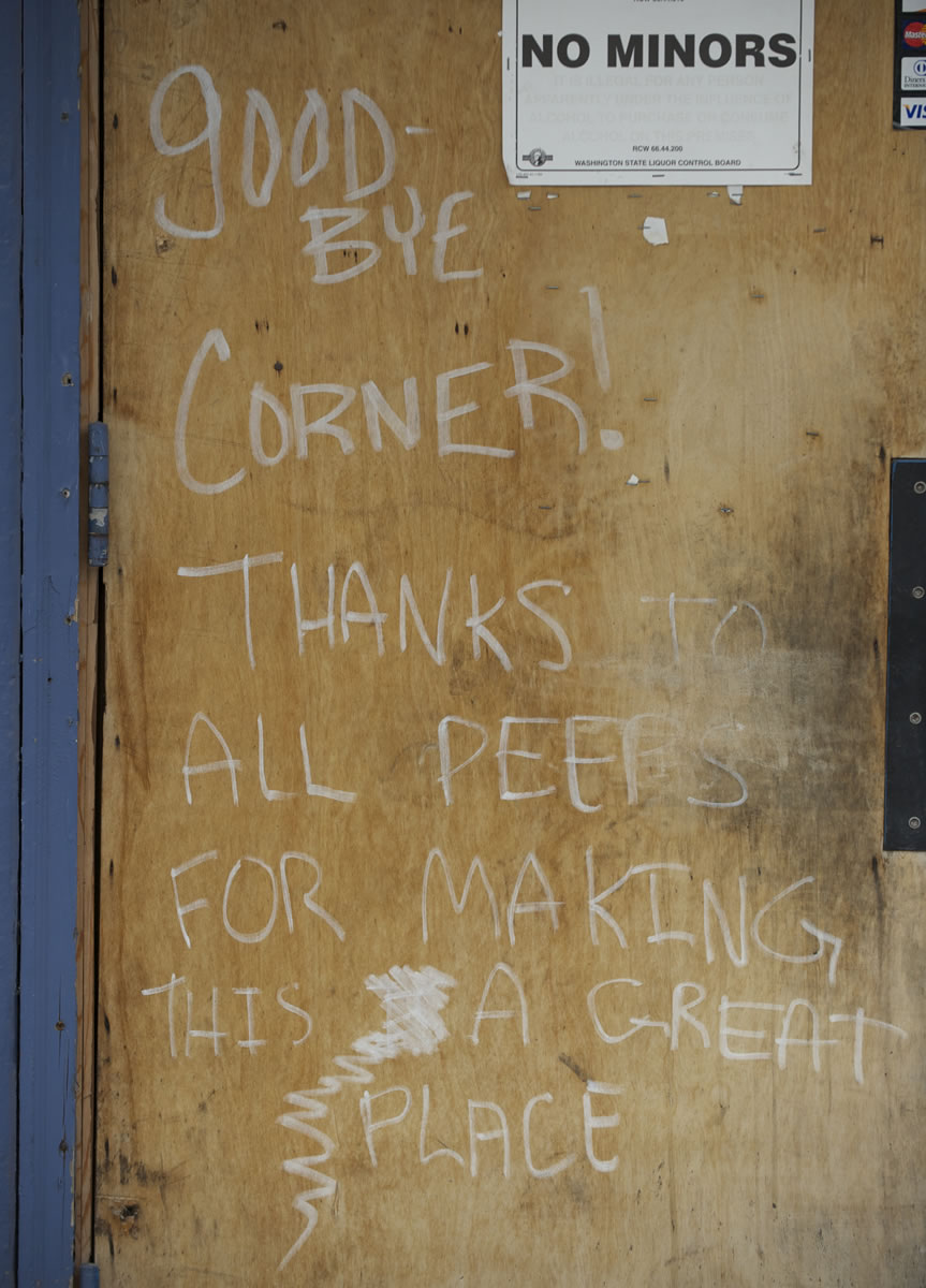 Steven Lane/The Columbian
A sign scrawled on the front of a shuttered Dollars Corner bar bids farewell to its former customers as it awaits its fate.