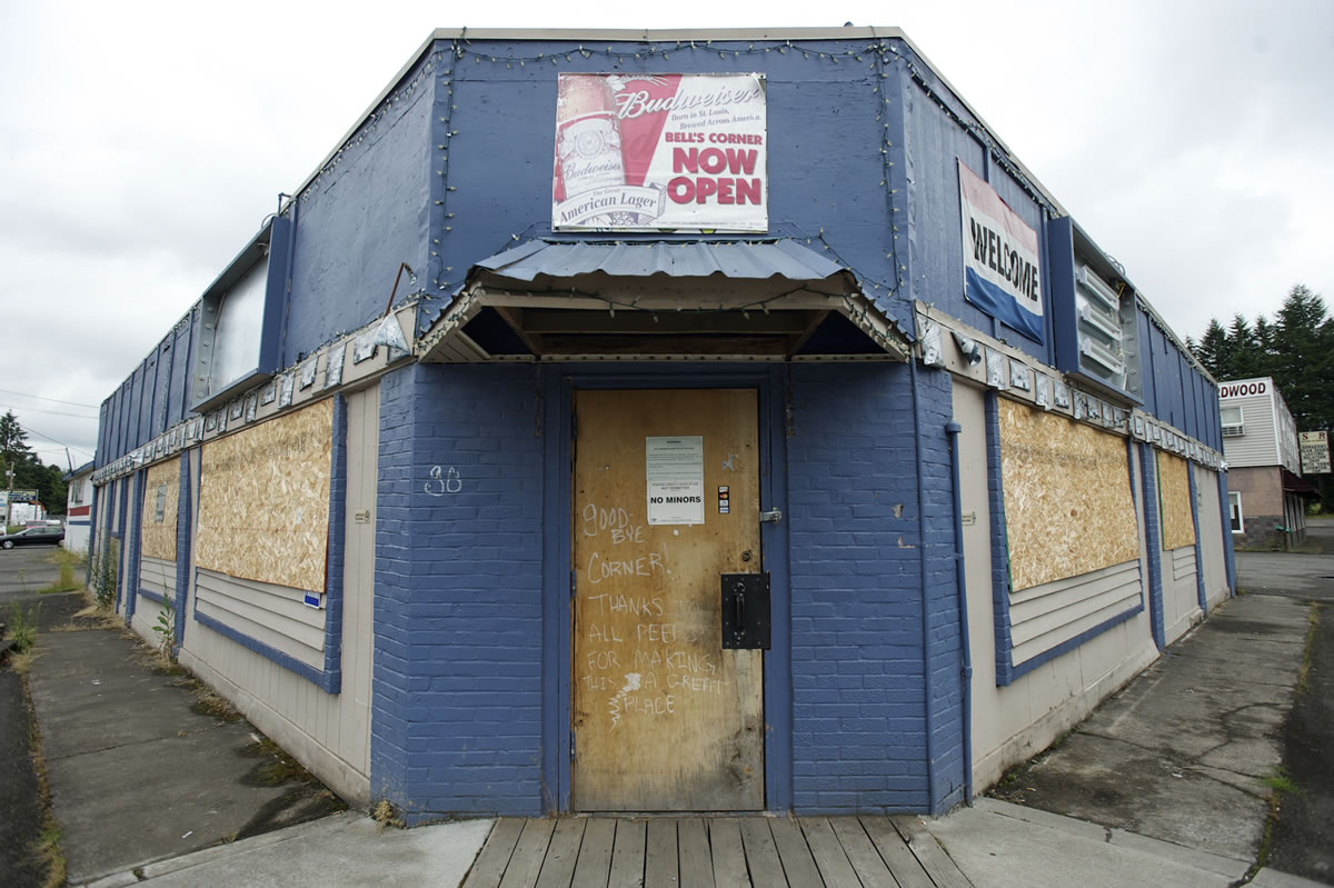 A bar at Dollars Corner sits boarded up waiting for the widening of Highway 502 between I-5 and Battle Ground, Friday, July 20, 2012.