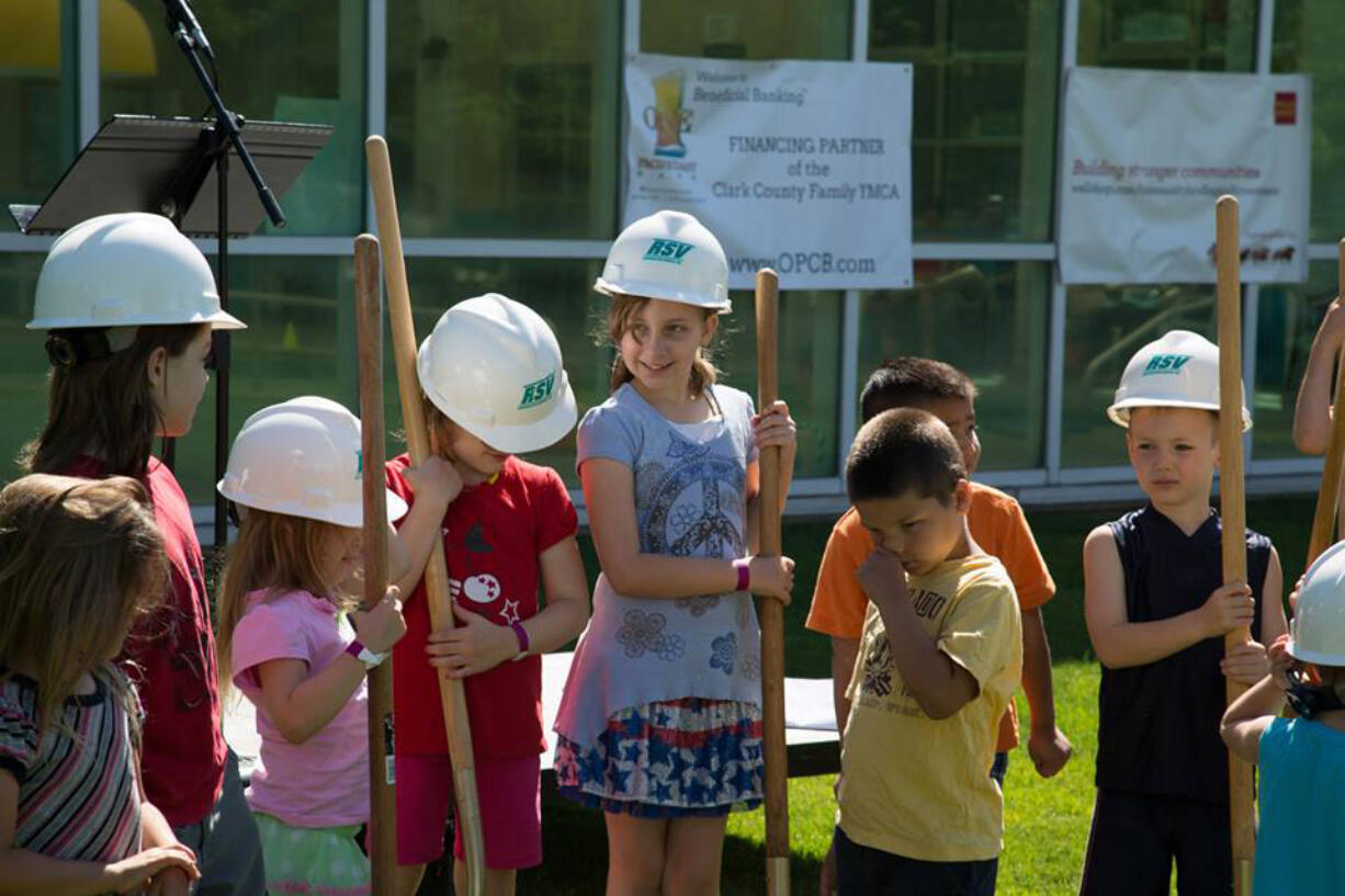 Orchards: Children hold ceremonial shovels at the Clark County Family YMCA in Orchards during its June 22 groundbreaking celebration.