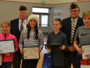 Washougal: Veterans of Foreign Wars members Ray Loney, back row from left, and Robert Hitchcock handing out awards to winners of the organization&#039;s annual essay contest to Canyon Creek Middle School students, from left: Simone Velanskey, Charlotte Baker, Bryce Holmes and Thomas Hein.