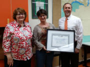 Battle Ground: Battle Ground High School teacher Jamie Hurly, from left, Sheryl Piper, counselor, and Mike Hamilton, principal, celebrate the school&#039;s 75th year of accreditation.