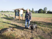 David Clarke, volunteer manager of Washougal's Stevenson Off-Leash Dog Area, lets his dogs Chinook, left, and Lakota run free at the property.