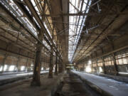 Massive structures, like the one pictured above, are remnants of what the site now operated by Millennium Bulk Terminals-Longview used to be: an aluminum smelting operation stretching back to 1941.