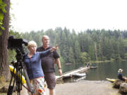 Gretel Rieber-Wicke shows cameraman Horst Poness her old stamping grounds at Battle Ground Lake. Rieber-Wicke of Germany was the first foreign exchange student at Battle Ground High School in 1952.