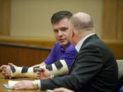 Former Skamania County Auditor John Michael Garvison, left, with attorney Jon McMullen, appear Thursday in Clark County Superior Court Judge Barbara Johnson's courtroom.