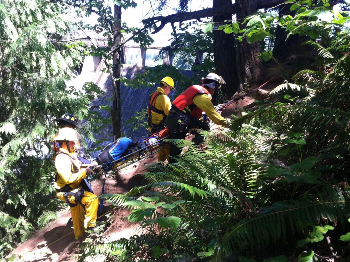 Camas-Washougal Fire Department rescuers practice evacuations during annual training sessions in July 2015 at the popular Potholes swimming area in north Camas.