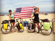 West Hazel Dell: Columbia River High School graduates Carolyn Murray and Joani Dahmen stop for a moment on their cross-country bicycle trip from California to Virginia.