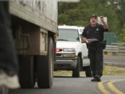 Clark County Sheriff's Deputy James Naramore stops a truck driver at Northeast 10th Avenue and Carty Road on Sept.