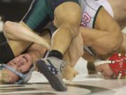 Stevenson's Tyler Miler, left,  is beaten by Erick Garcia from Chelan in the finals of the 132lb weight class of the 1A State Wrestling Tournament in Tacoma, Saturday, February 16, 2013.