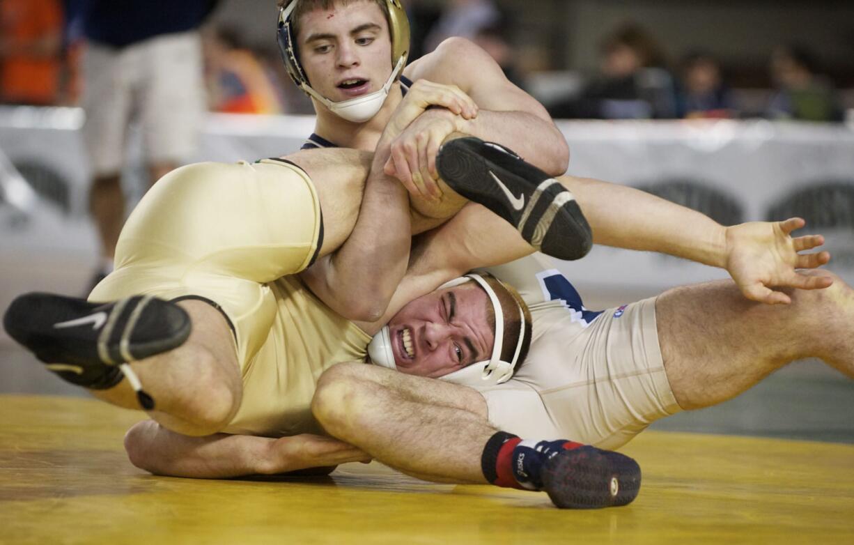 Evergreen's Anthony Thomas is beaten by Mead's Chandler Rodgers in the finals of the 4A State Wrestling Tournament in Tacoma, Saturday, February 16, 2013.