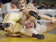 Evergreen's Anthony Thomas is beaten by Mead's Chandler Rodgers in the finals of the 4A State Wrestling Tournament in Tacoma, Saturday, February 16, 2013.