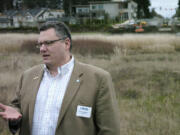 Camas Mayor Scott Higgins discusses the extension of Southeast 20th Street to Northwest 38th Avenue as workers with Tapani Inc. break ground.