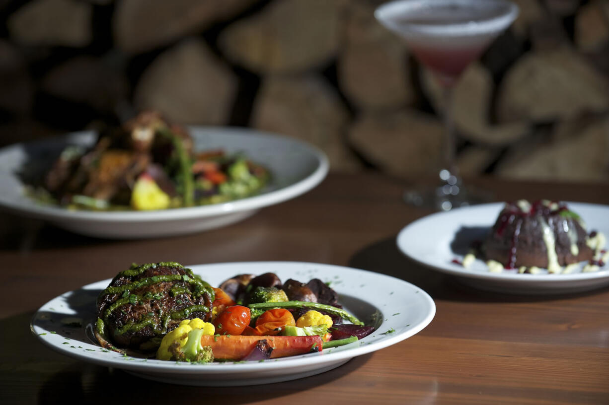 The Tournedos (filet mignon special) foreground, Crispy Thai Chicken and Chocolate Orange Lava Cake at Hearth in Washougal.