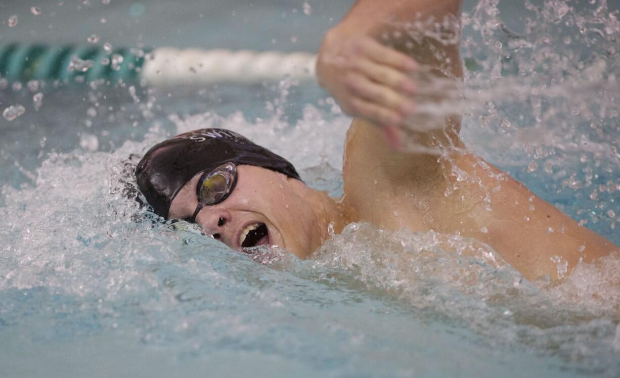 Camas swimmer Seth Albert wins the 200 yard freestyle race at the 4A District Swim Championships at Propstra Aquatic Center on Thursday.