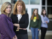 From left, Krista Roadifer, school counselor; Kelly Johnson, a Battle Ground school district psychologist; and eighth-grade students Sarah Miller and Madison Schumacher stand outside Chief Umtuch Middle School.