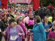 Participants leave the starting line of the 2012 Girlfriends Half Marathon on Sunday. Profits from the event will go to Susan G.