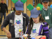 Battle Ground: Clark County 4-H Robotics Club members Nadia Khan, left, and Grace Fulfer. Their team, &quot;The Soggy Cloverteers,&quot; took a first place at the annual Intel Oregon FIRST LEGO League Championship Tournament on Jan.