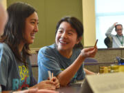 Bennington: Abigail Jiang, right, confers with teammate Misum Chang. The Shahala Middle School students competed in the BPA Regional Science Bowl held Jan.