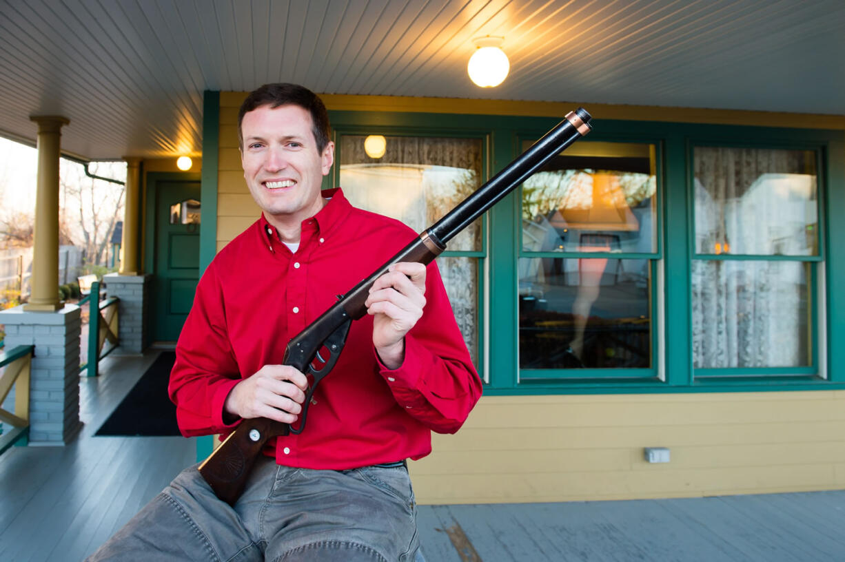 Museum owner Brian Jones holds the Red Ryder BB Gun used in the movie at A Christmas Story House and Museum in Cleveland. The Museum has recently acquired the movie prop and added it to their collection.