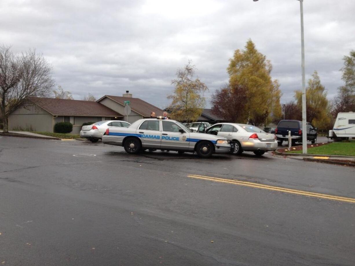 Camas police set up containment near Dorothy Fox Elementary today as they look for a burglary suspect who rammed a police car, injuring an officer.