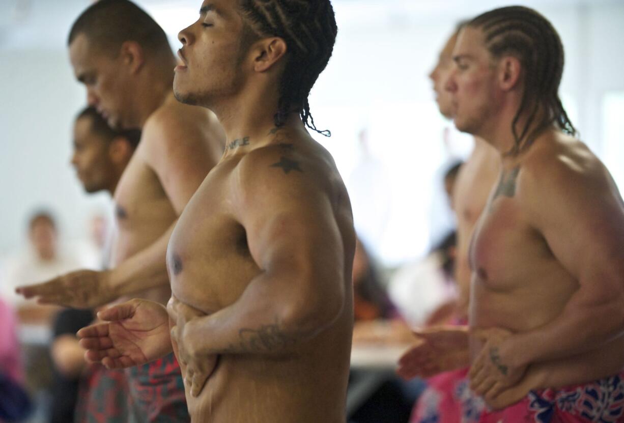 Larch Corrections Center offender Zachary Driver dances with other inmates during an Asian Pacific Islander, or API, cultural event inside the prison's mess hall on May 19.