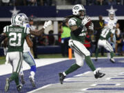 New York Jets free safety Marcus Gilchrist (21) watches as strong safety Calvin Pryor (25) intercepts a pass intended for Dallas&#039; Dez Bryant, left rear, in the second half Saturday.