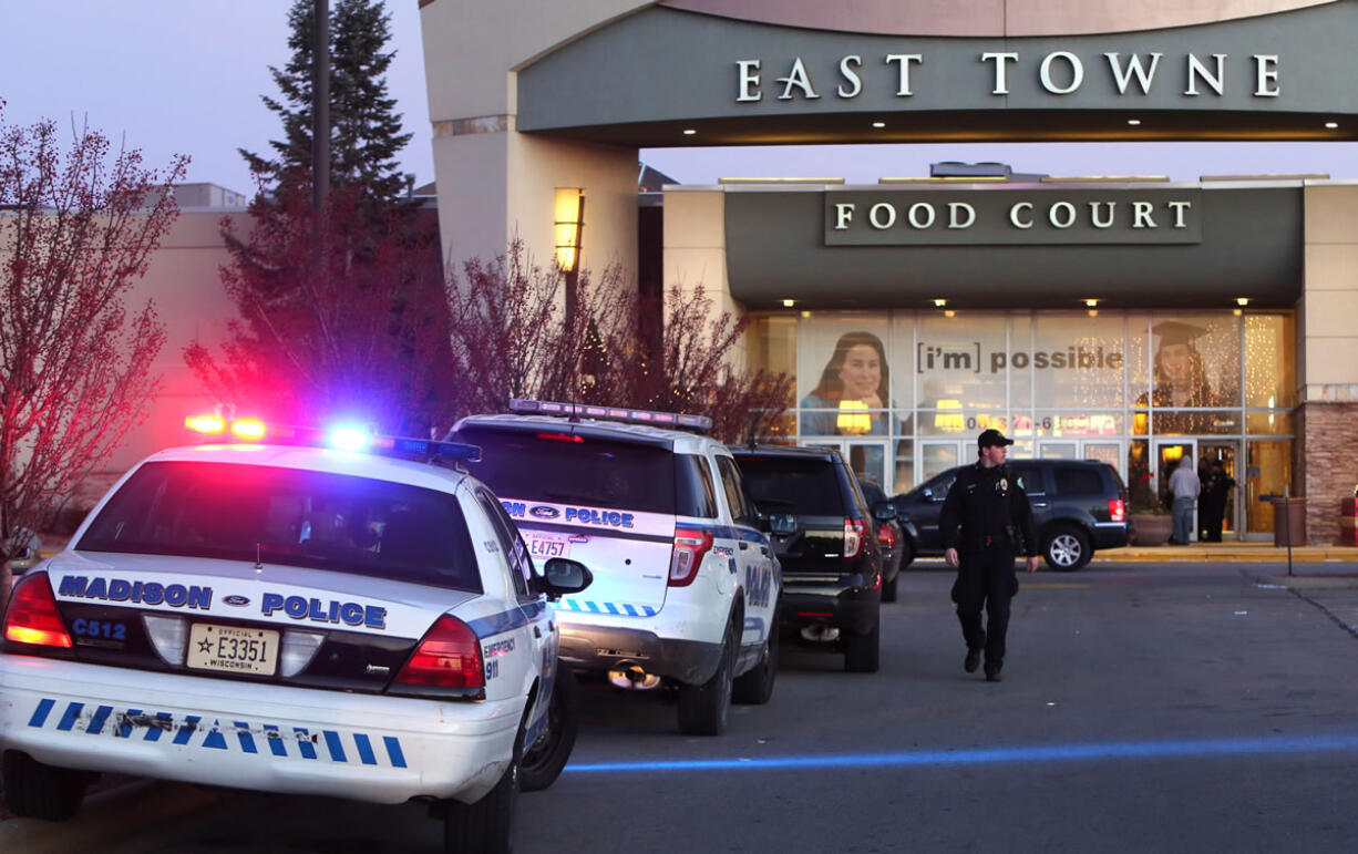 Authorities respond to reports of shots fired at East Towne Mall in Madison, Wis., Saturday, Dec. 19, 2015. Madison police said one person was shot in the leg during a &quot;disturbance&quot; inside the mall but his injuries are not life threatening.