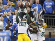 Green Bay Packers tight end Richard Rodgers (82) reaches to catch the game winning pass on the last play against the Detroit Lions on Thursday in Detroit.