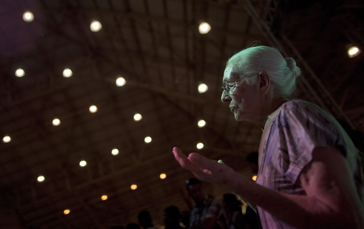 A woman prays during a Sunday mass at the Mother of God sanctuary in Sao Paulo, Brazil.