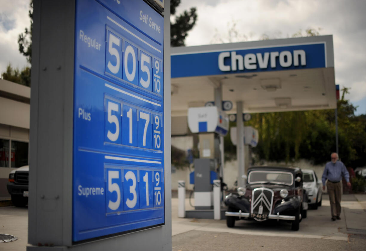 Gasoline prices higher than $5 per gallon are posted at a Menlo Park, Calif., Chevron station earlier this year, when in California, gasoline prices jumped overnight by as much as 20 cents a gallon while some stations closed and others charged record prices.