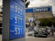 Gasoline prices higher than $5 per gallon are posted at a Menlo Park, Calif., Chevron station earlier this year, when in California, gasoline prices jumped overnight by as much as 20 cents a gallon while some stations closed and others charged record prices.