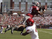 Washington State wide receiver Isiah Myers (88) catches a pass over Eastern Washington defensive back Allen Brown for a 17-yard touchdown from Jeff Tuel during the second quarter Saturday.