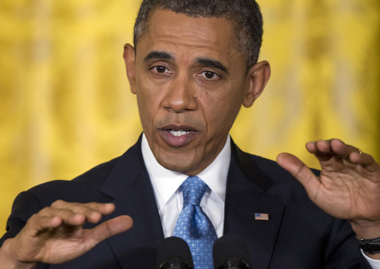 President Barack Obama gestures as he speaks during the last news conference of his first term in the East Room of the White House in Washington, Monday, Jan. 14, 2013.