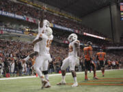 Texas wide receiver Marquise Goodwin is lifted after his 36-yard touchdown catch in the fourth quarter against Oregon State in the Alamo Bowl on Saturday.