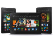 The new 8.9-inch Amazon Kindle HDX tablet computer, center, the 7-inch Kindle HDX, left, and the updated Kindle HD.