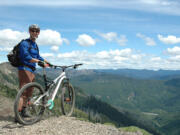 Paul Karr of Bend stops for a break overlooking the headwall of Ape Canyon on the southeast side of Mount St.