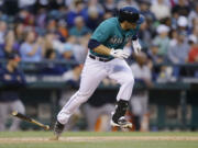 Seattle Mariners Mike Zunino runs for first base but grounded out in the sixth inning of a baseball game against the Houston Astros, Wednesday, June 12, 2013, in Seattle. (AP Photo/Ted S.