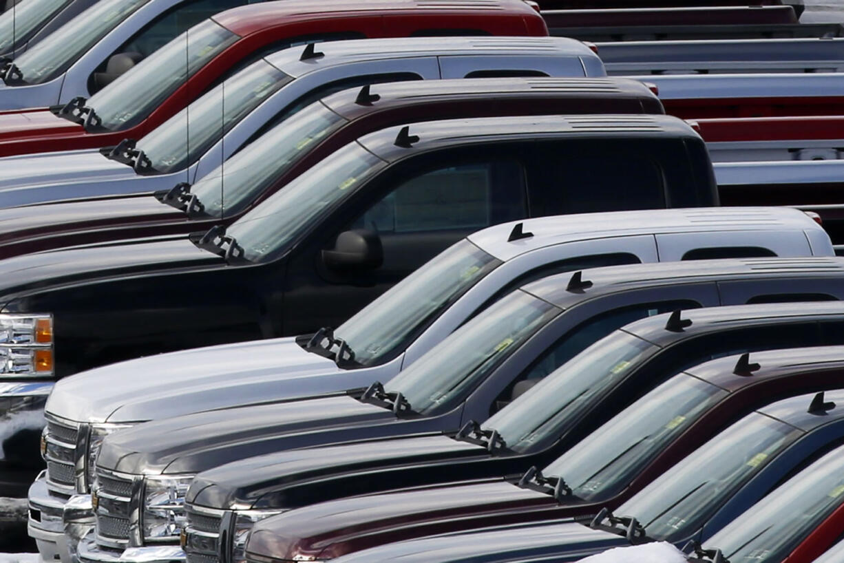 Chevy trucks line the lot of a dealer Jan. 9 in Murrysville, Pa. Ford, Chrysler and General Motors all reported double-digit gains for January as last year's momentum in U.S.